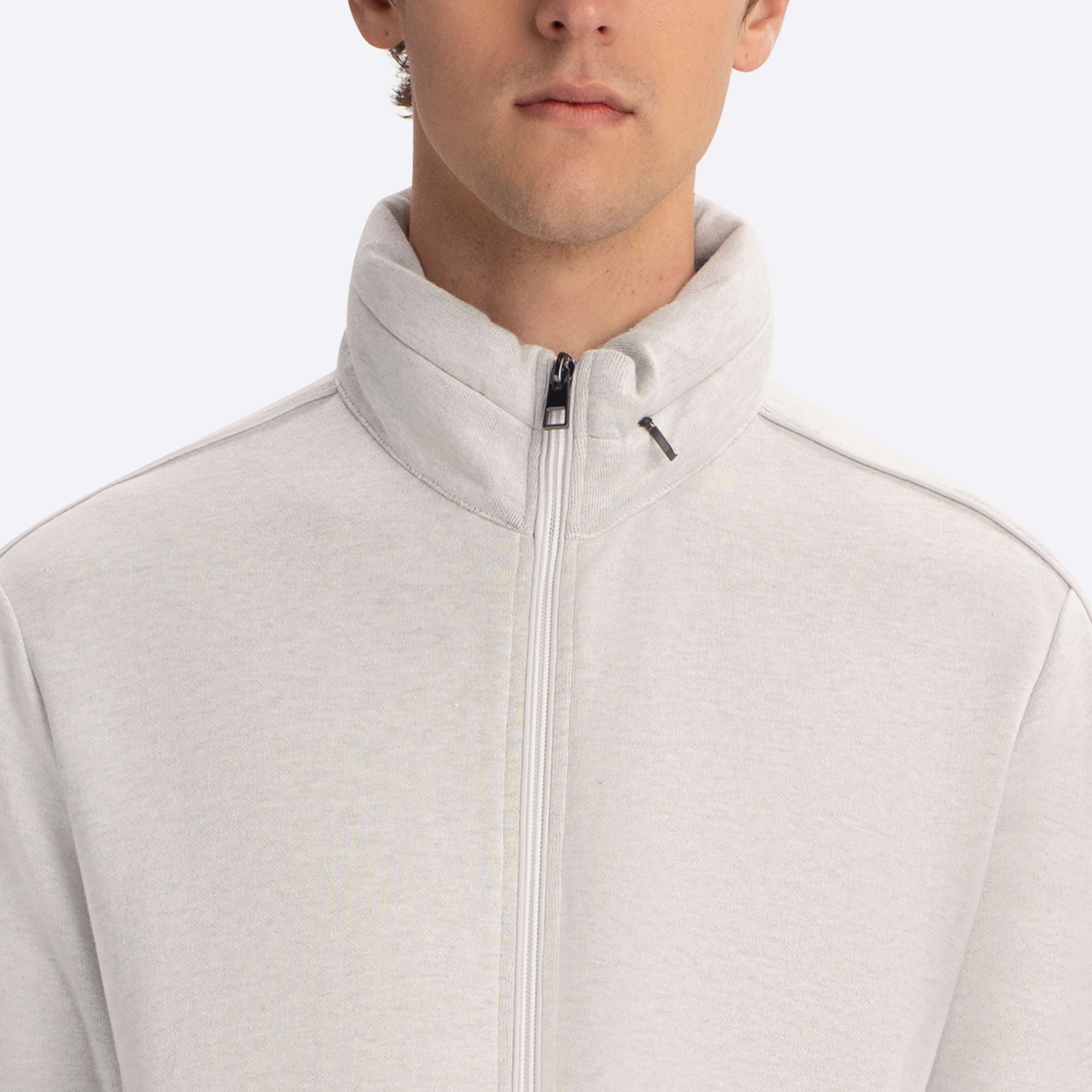 Full Zip Mock Neck Sweatshirt with Stow-Away Hood.